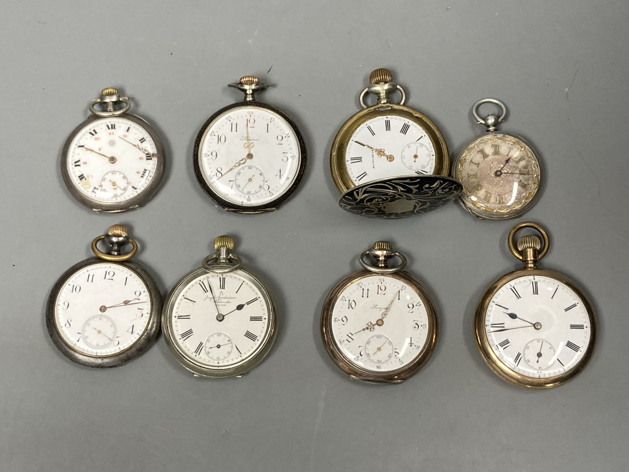 Eight assorted pocket watches including gun metal, gold plated, white metal and base metal Longines and a quantity of watch keys.
